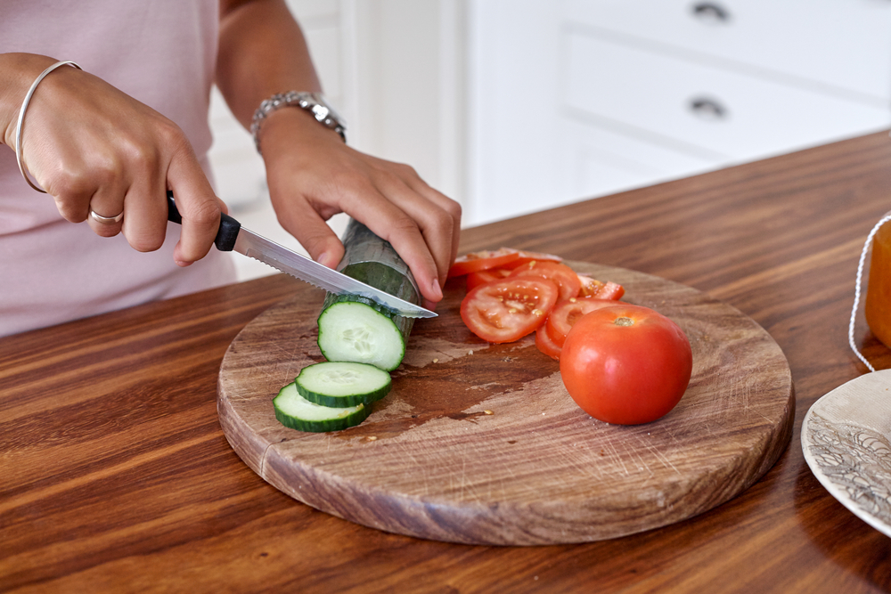 Preparing a Meal on a Wooden Countertop