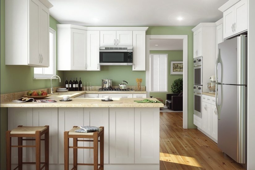 White cabinets and a medium-stain wooden floor lend a rustic feel to a kitchen.