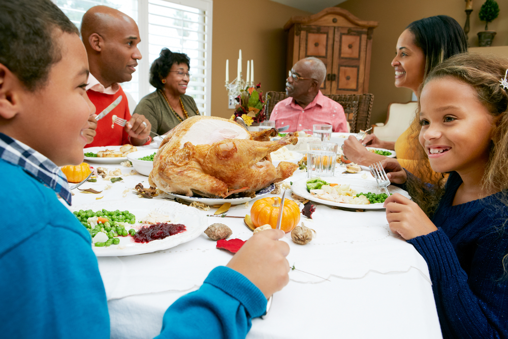 Family Gathered Around Thanksgiving Table