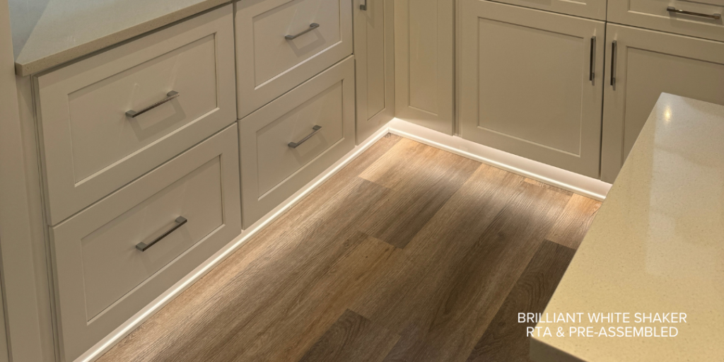 Toe-kick lighting kitchen with Brilliant White Shaker cabinets